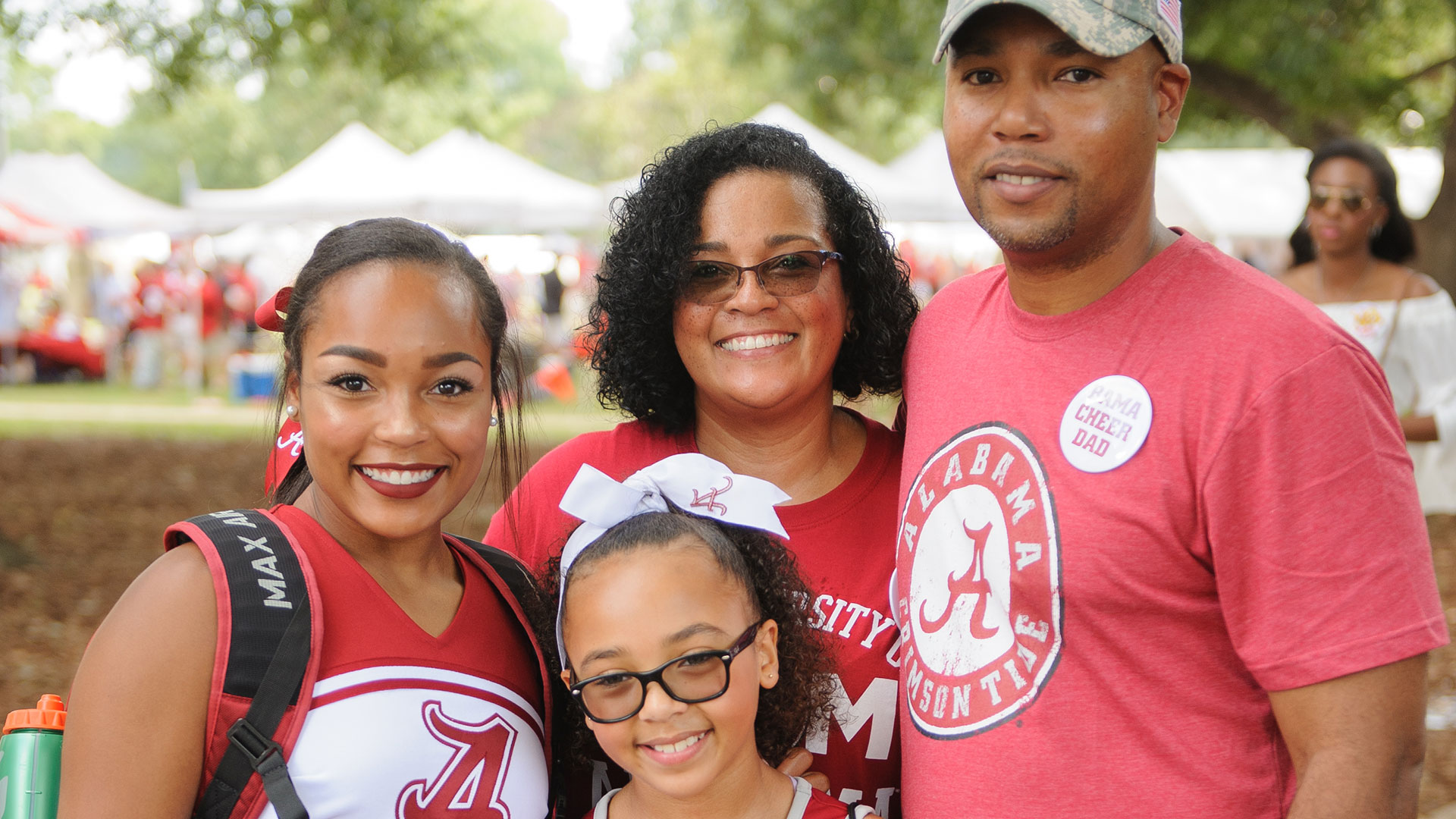 A family in UA gear on the quad.